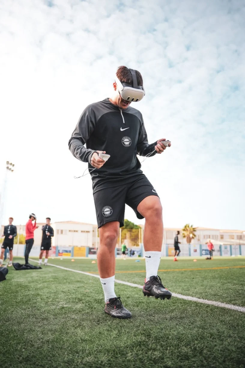 Footballer Trains on Pitch wearing VR