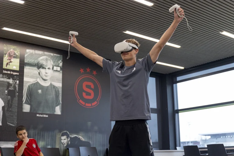 Footballer celebrates whilst wearing VR Gear
