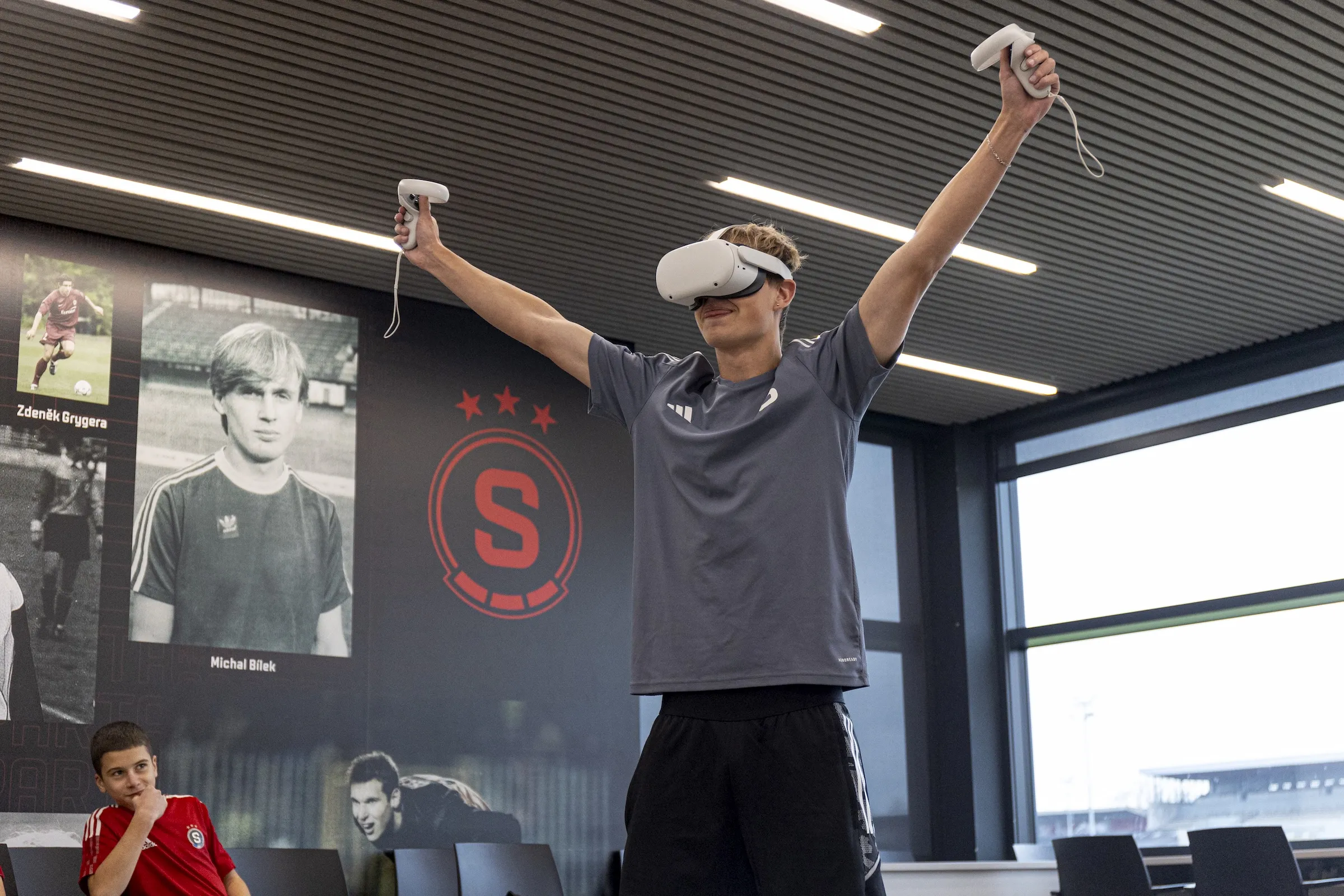 Footballer celebrates whilst wearing VR Gear