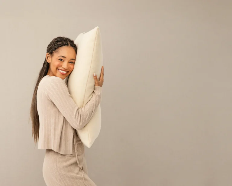 Person hugging a wool pillow