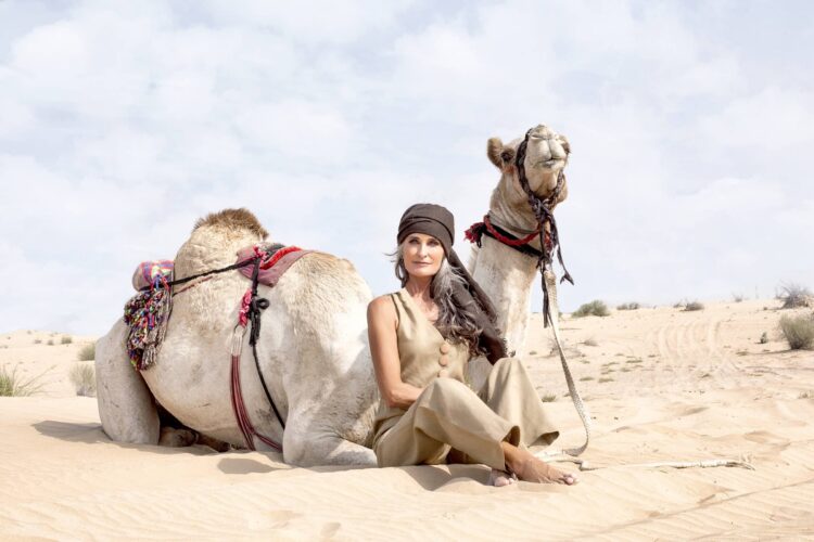 Caroline Labouchere next to a Camel