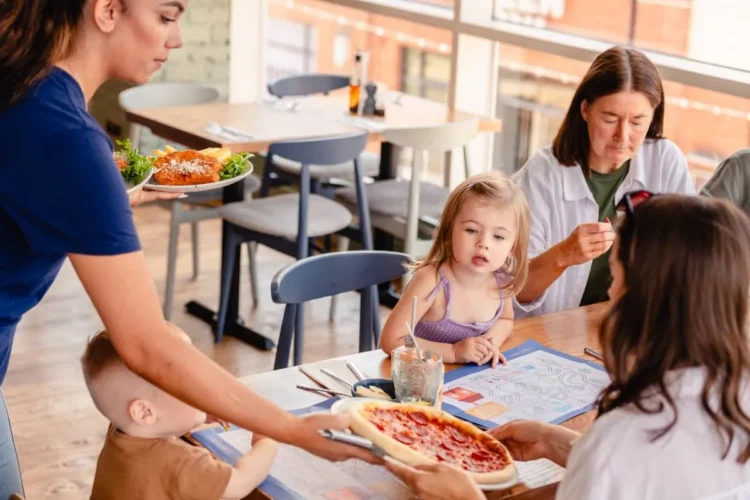 Child looks excitedly at a Pizza