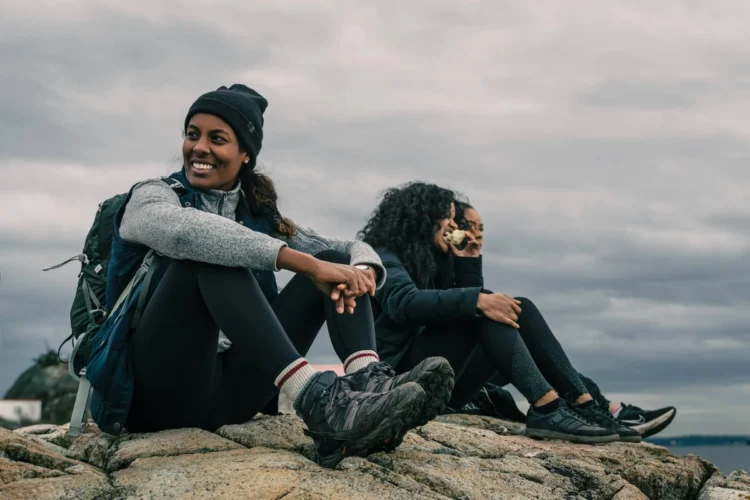 People sit on top of cliff top