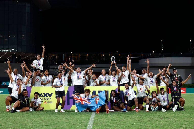 Fiji celebrate as Kolora Lomani of Fiji lifts the trophy