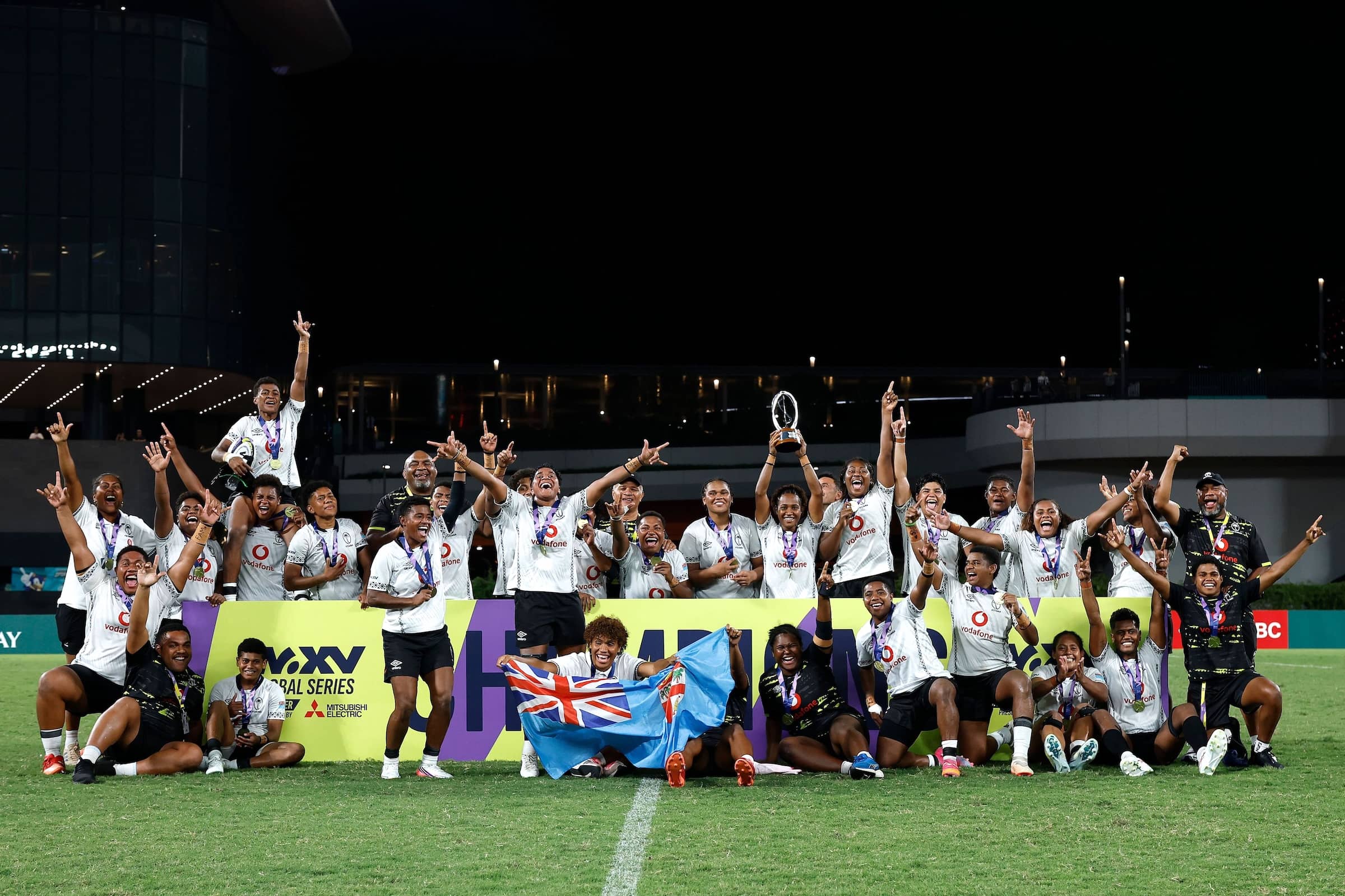 Fiji celebrate as Kolora Lomani of Fiji lifts the trophy