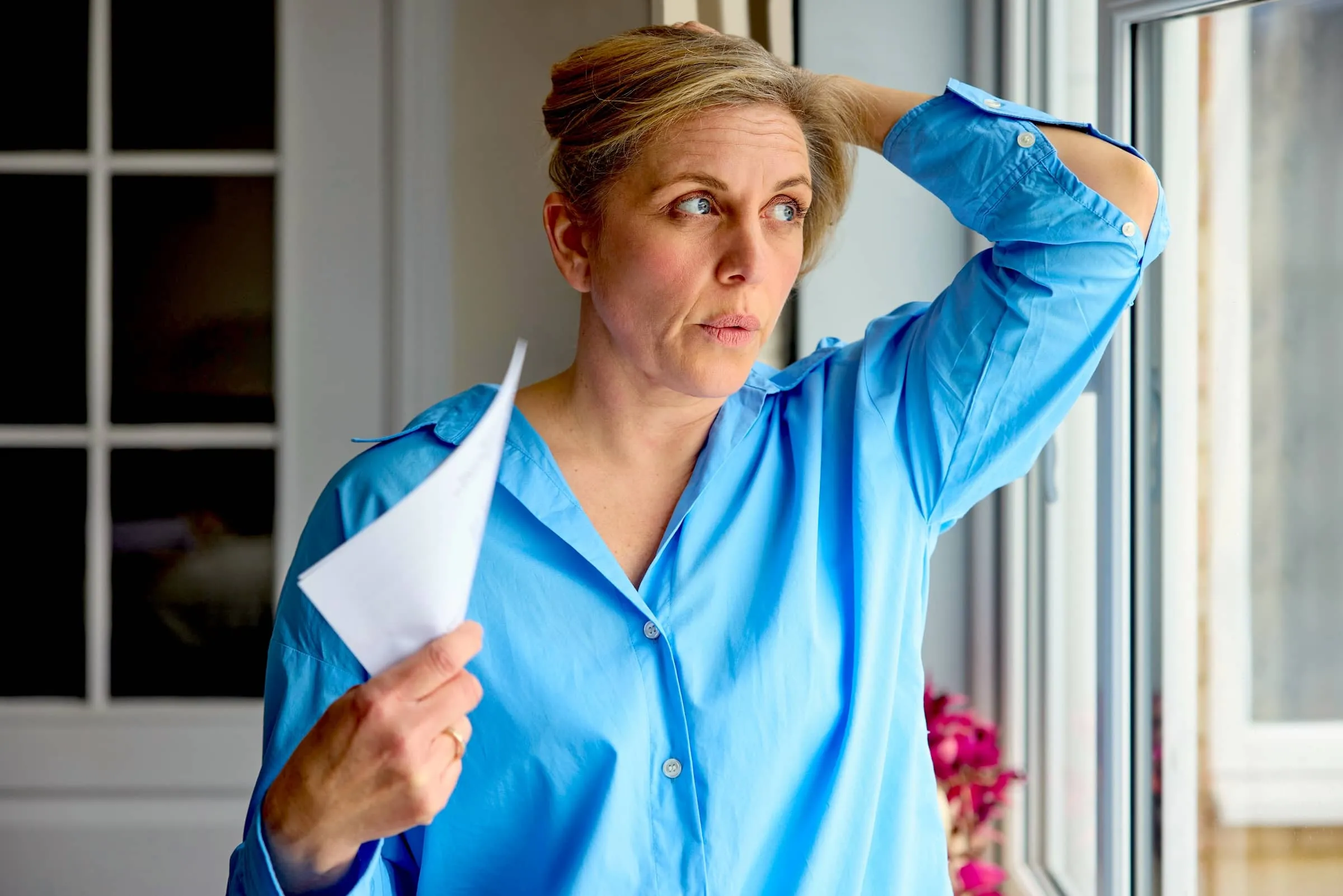 Mature Woman Having Hot Flush At Home