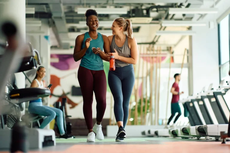athletic women having fun during sports training in gym