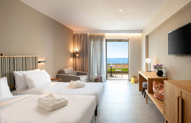 Modern minimalistic style Double hotel room with open French window and sea view