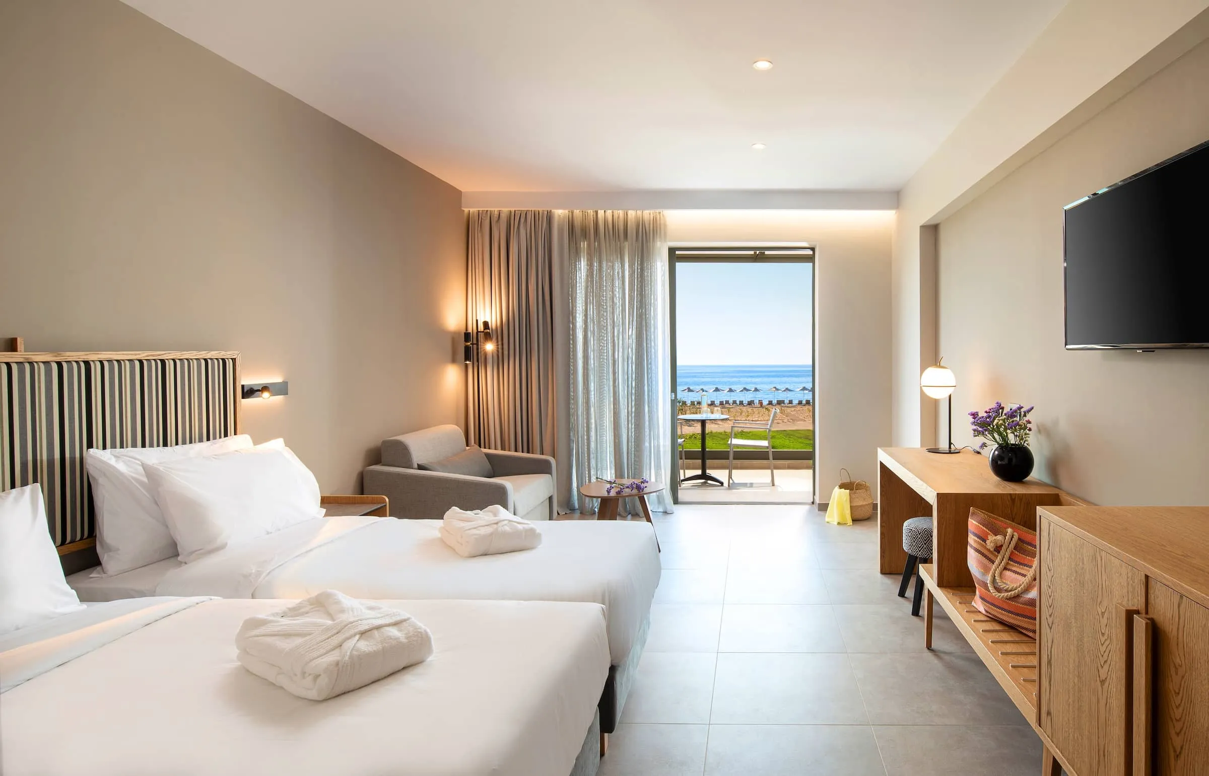 Modern minimalistic style Double hotel room with open French window and sea view