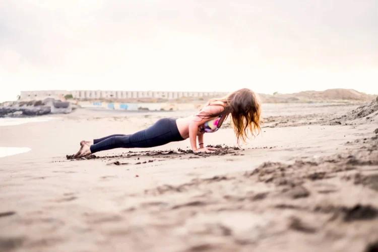 Person doing fitness at the beach in outdoor leisure activity