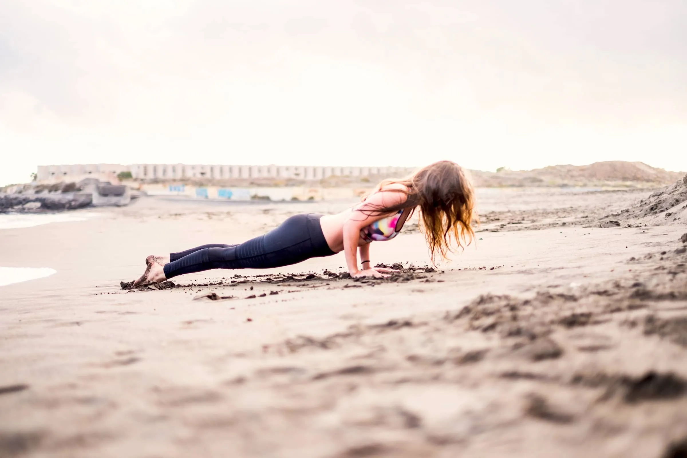 Person doing fitness at the beach in outdoor leisure activity